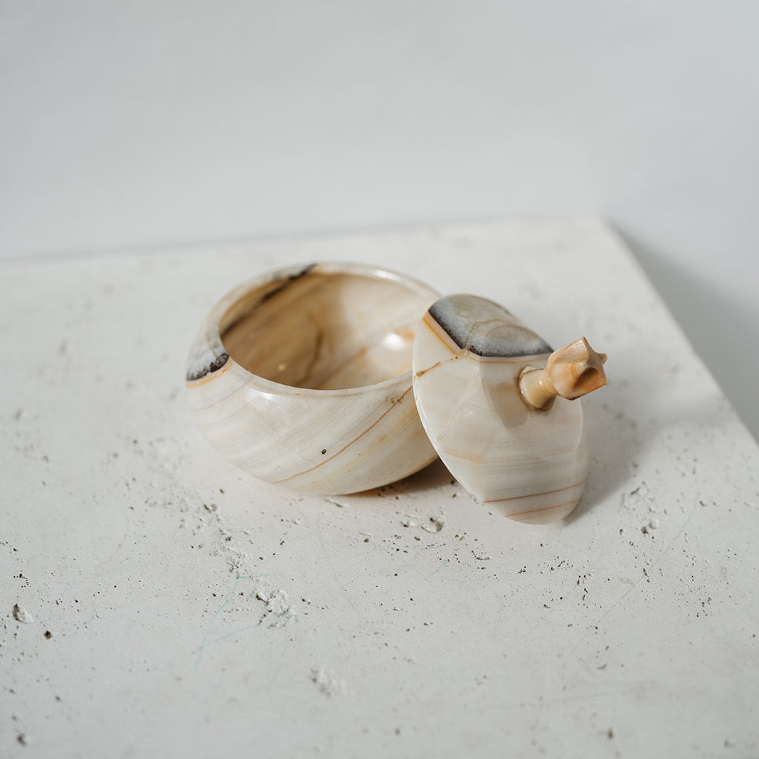 Lidded container with onyx and white stone 