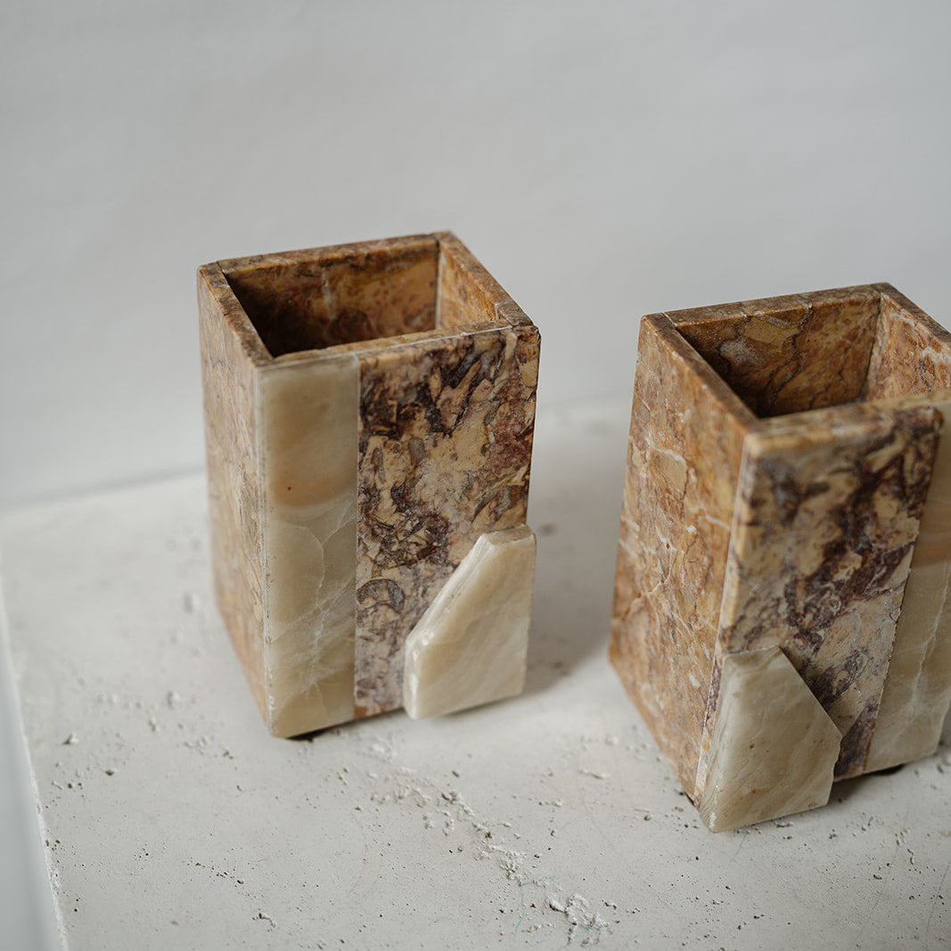 Decorative stone bookends with brass feet 