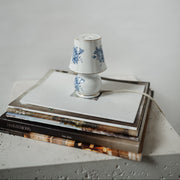 Small decorative porcelain lamp with blue floral design