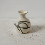 Small ceramic bud vase with black design 
