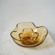Vintage amber stacking bowls with a pinched texture on the edges  