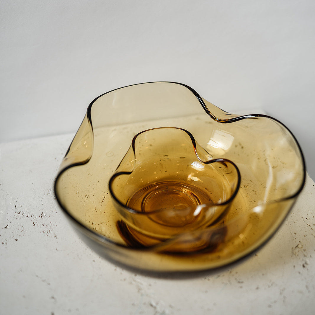 Vintage amber stacking bowls with a pinched texture on the edges  