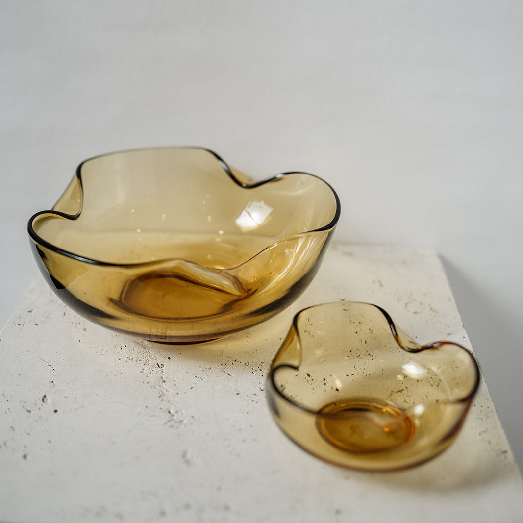 Vintage amber stacking bowls with a pinched texture on the edges  