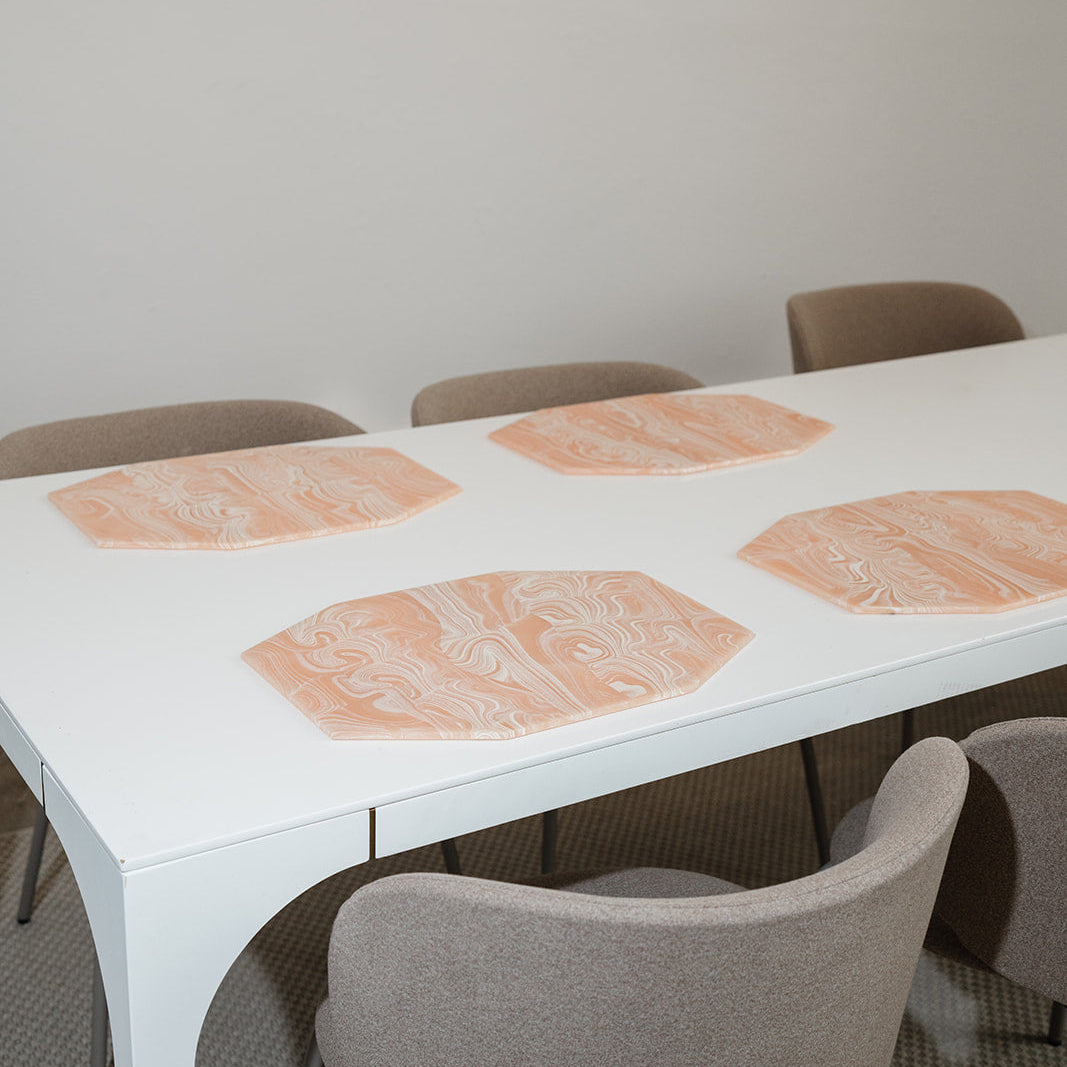 Acrylic marbled hexagon trays set on the table 